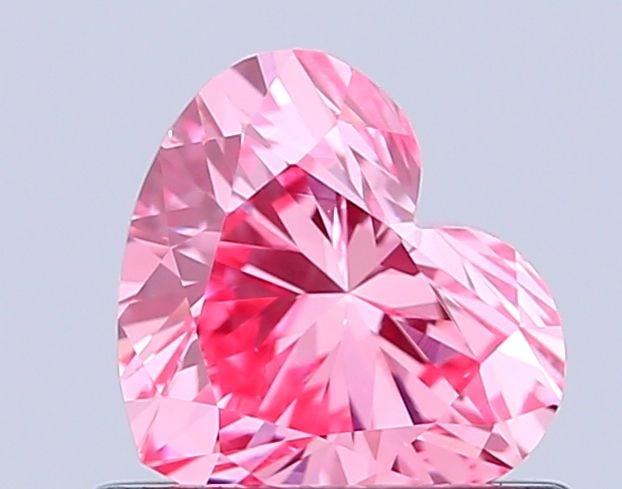 Loose Diamond - HEART 0.65ct Fancy Vivid Pink VS1: Loose Diamond - HEART 0.65ct Fancy Vivid Pink VS1 Source: This is a real non-mined Diamond that has been grown in a lab Shape: HEART Carats: 0.65 Color: Fancy Vivid Pink Certification: IGI Video: