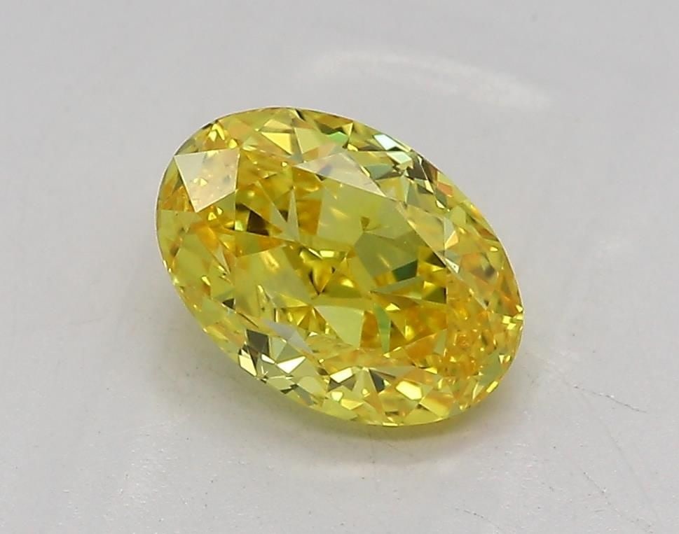 Loose Diamond - OVAL 1.05ct Fancy Vivid Yellow VVS2: Loose Diamond - OVAL 1.05ct Fancy Vivid Yellow VVS2 Source: This is a real non-mined Diamond that has been grown in a lab Shape: OVAL Carats: 1.05 Color: Fancy Vivid Yellow Certification: IGI Video: