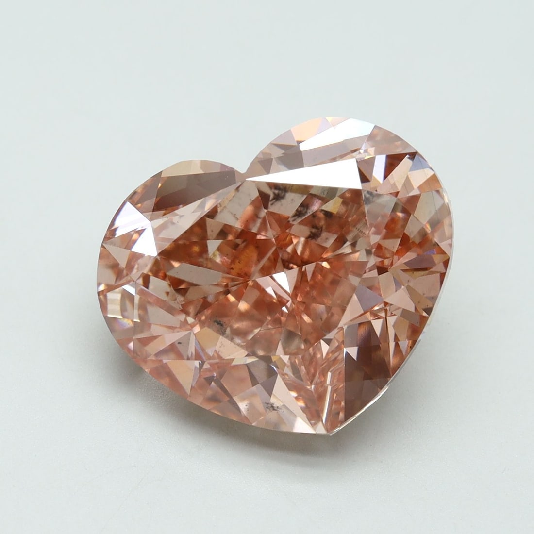 Loose Diamond - HEART 10.11ct Fancy Vivid Pink SI1: Loose Diamond - HEART 10.11ct Fancy Vivid Pink SI1 Source: This is a real non-mined Diamond that has been grown in a lab Shape: HEART Carats: 10.11 Color: Fancy Vivid Pink Certification: IGI Video: