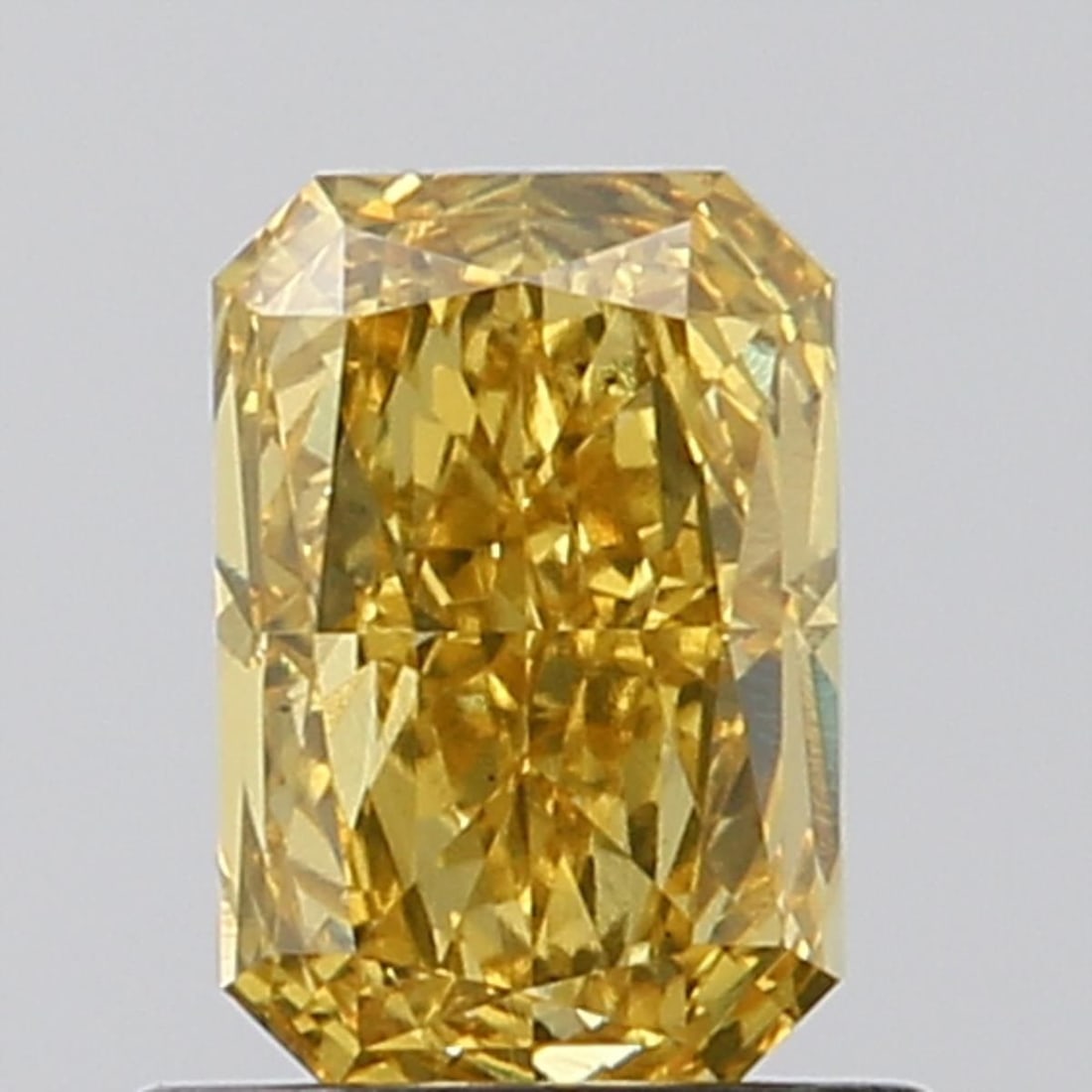 Loose Diamond - RADIANT 1.0ct Fancy Vivid Yellow VS2: Loose Diamond - RADIANT 1.0ct Fancy Vivid Yellow VS2 Source: This is a real non-mined Diamond that has been grown in a lab Shape: RADIANT Carats: 1.0 Color: Fancy Vivid Yellow Certification: NONE Vide