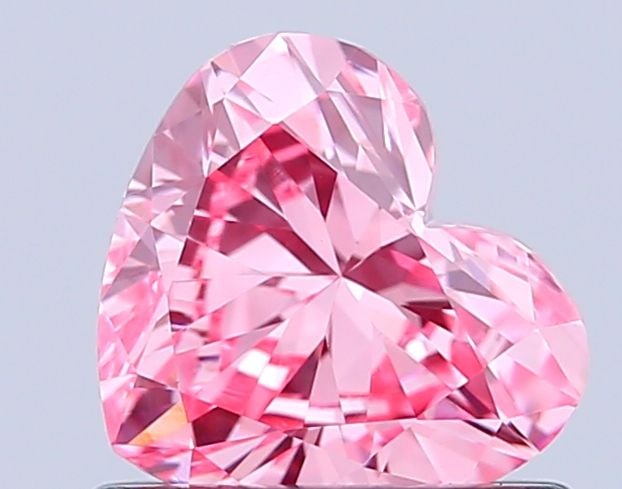 Loose Diamond - HEART 0.7ct Fancy Vivid Pink VVS2: Loose Diamond - HEART 0.7ct Fancy Vivid Pink VVS2 Source: This is a real non-mined Diamond that has been grown in a lab Shape: HEART Carats: 0.7 Color: Fancy Vivid Pink Certification: IGI Video: