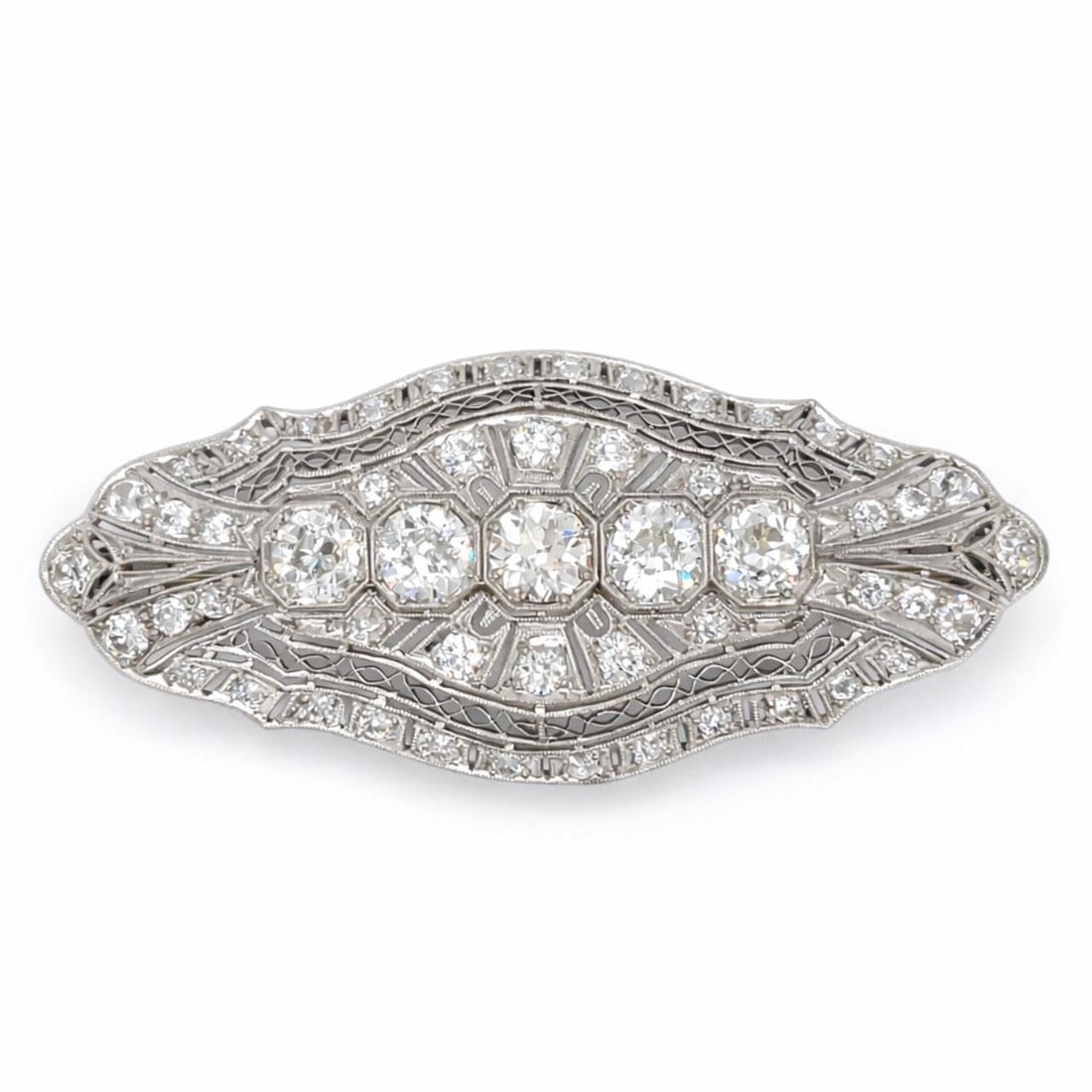 Platinum Art Deco Brooch with 5.70 Carats of Diamonds: Platinum Art Deco Brooch with 5.70 Carats of Diamonds This Art Deco brooch is crafted in platinum and showcases a total diamond weight of approximately 5.70 carats. The design features 5 diamonds tota