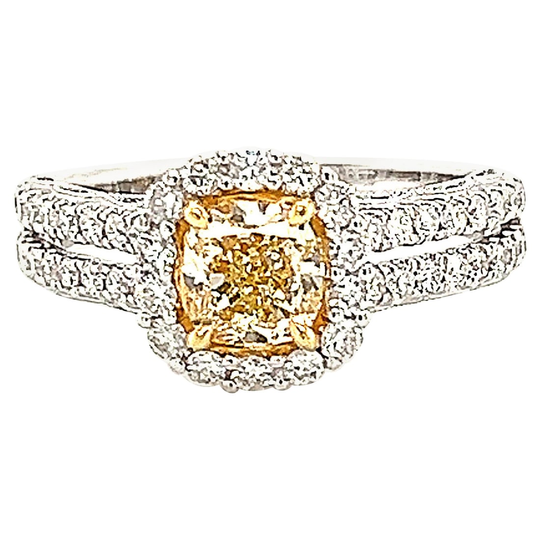 1.67ct Fancy Yellow VVS2 Halo Diamond Ring 18k: 1.67ct Fancy Yellow VVS2 Halo Diamond Ring 18k This exquisite 1.67ctt Fancy Yellow VVS2 Cushion Diamond Halo Ring features a stunning modern design crafted in luxurious 18k yellow and white gold. The 