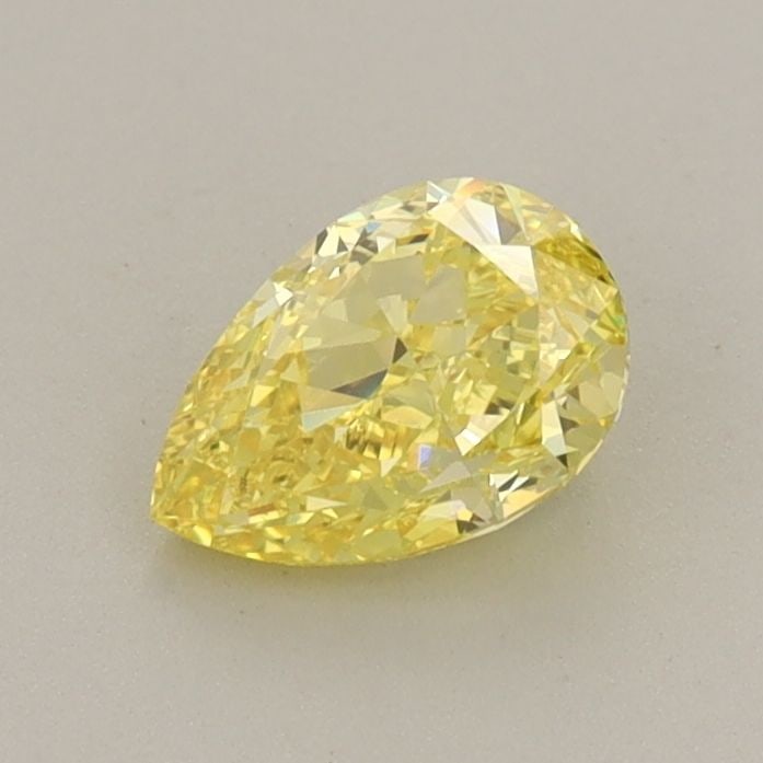 Loose Diamond - PEAR 0.65ct Fancy Vivid Yellow VS1: Loose Diamond - PEAR 0.65ct Fancy Vivid Yellow VS1 Source: This is a real non-mined Diamond that has been grown in a lab Shape: PEAR Carats: 0.65 Color: Fancy Vivid Yellow Certification: IGI Video: