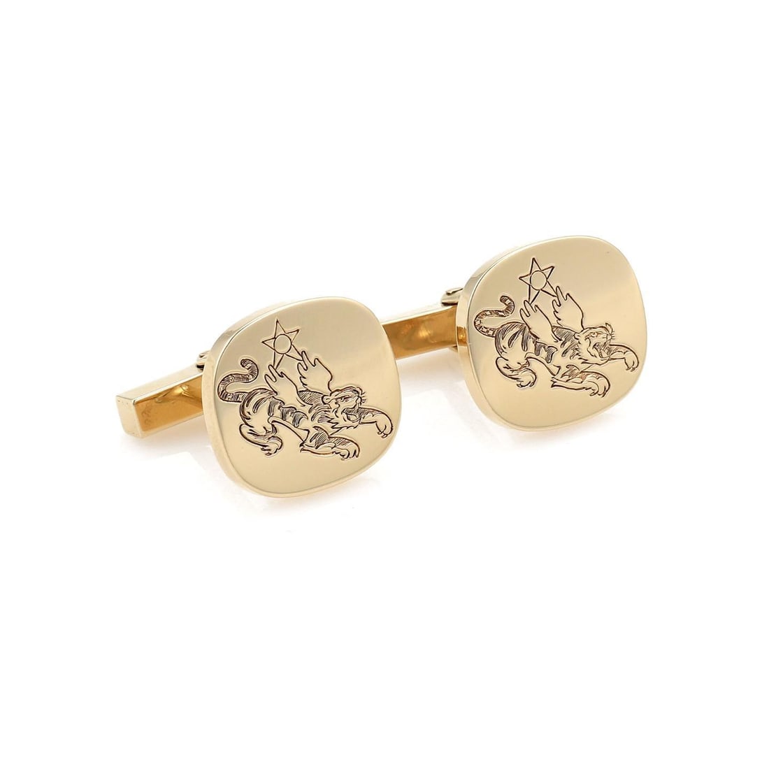 Pair of Tiffany 14k Gold Cufflinks With Carved Winged Tiger Motif: Pair of Tiffany 14k Gold Cufflinks With Carved Winged Tiger Motif This vintage pair of Tiffany & Co. cufflinks is crafted from 14k yellow gold with a polished finish. Each oval button top features a d