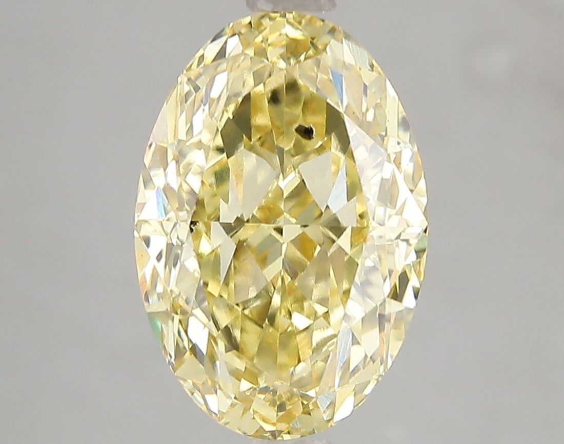 Loose Diamond - OVAL 5.02ct Fancy Vivid Yellow SI2: Loose Diamond - OVAL 5.02ct Fancy Vivid Yellow SI2 Source: This is a real non-mined Diamond that has been grown in a lab Shape: OVAL Carats: 5.02 Color: Fancy Vivid Yellow Certification: IGI Video: