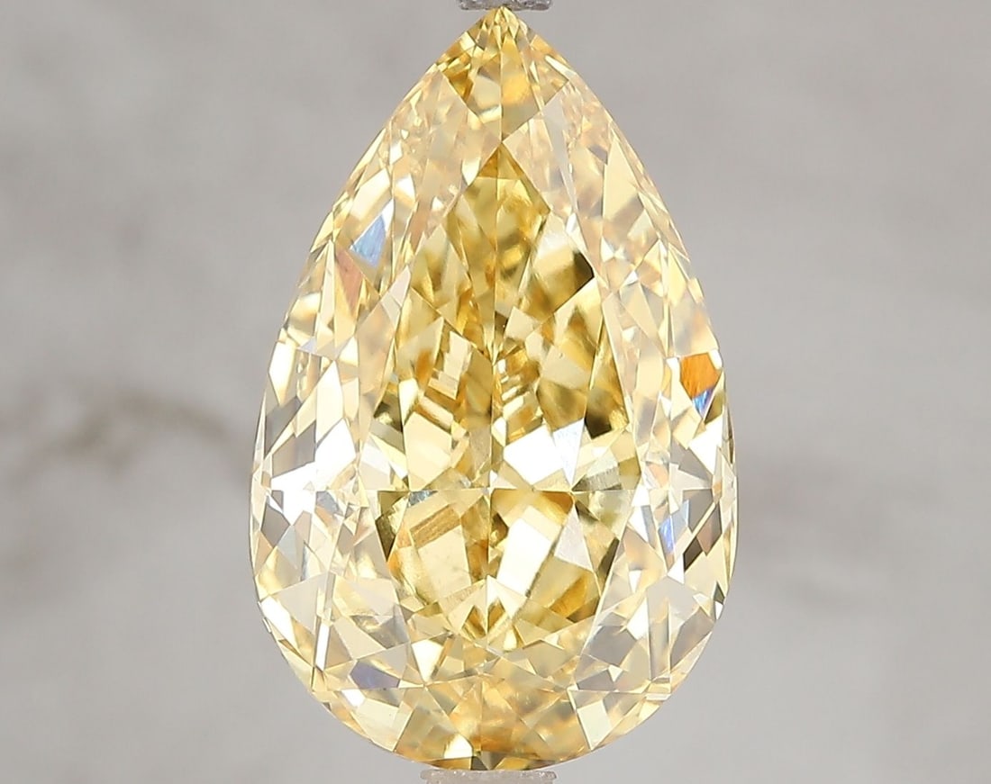 Loose Diamond - PEAR 6.55ct Fancy Vivid Yellow VS2: Loose Diamond - PEAR 6.55ct Fancy Vivid Yellow VS2 Source: This is a real non-mined Diamond that has been grown in a lab Shape: PEAR Carats: 6.55 Color: Fancy Vivid Yellow Certification: IGI Video: