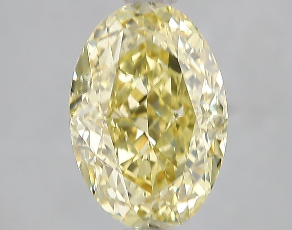 Loose Diamond - OVAL 3.11ct Fancy Vivid Yellow VS2: Loose Diamond - OVAL 3.11ct Fancy Vivid Yellow VS2 Source: This is a real non-mined Diamond that has been grown in a lab Shape: OVAL Carats: 3.11 Color: Fancy Vivid Yellow Certification: IGI Video: