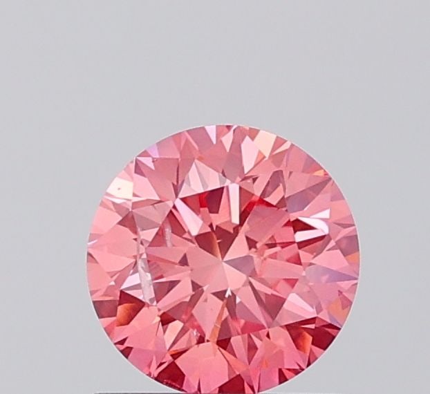Loose Diamond - ROUND 1.0ct Fancy Vivid Pink SI2: Loose Diamond - ROUND 1.0ct Fancy Vivid Pink SI2 Source: This is a real non-mined Diamond that has been grown in a lab Shape: ROUND Carats: 1.0 Color: Fancy Vivid Pink Certification: IGI Video: