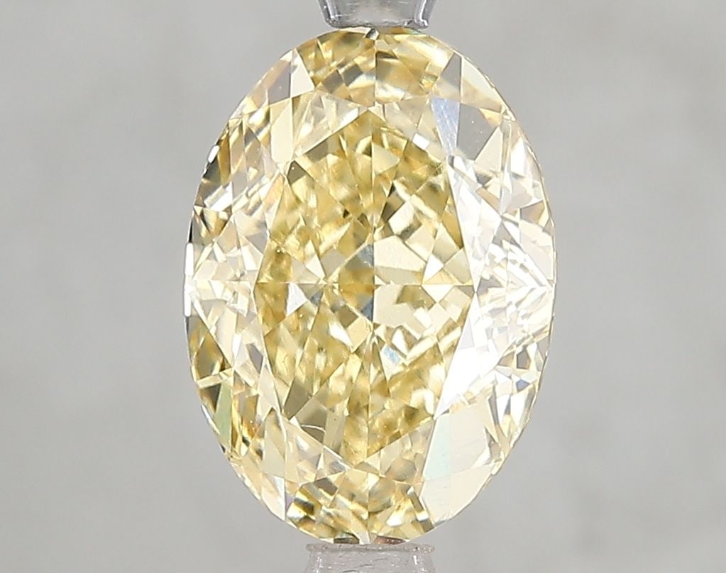 Loose Diamond - OVAL 3.06ct Fancy Intense Yellow VVS2: Loose Diamond - OVAL 3.06ct Fancy Intense Yellow VVS2 Source: This is a real non-mined Diamond that has been grown in a lab Shape: OVAL Carats: 3.06 Color: Fancy Intense Yellow Certification: IGI Vide