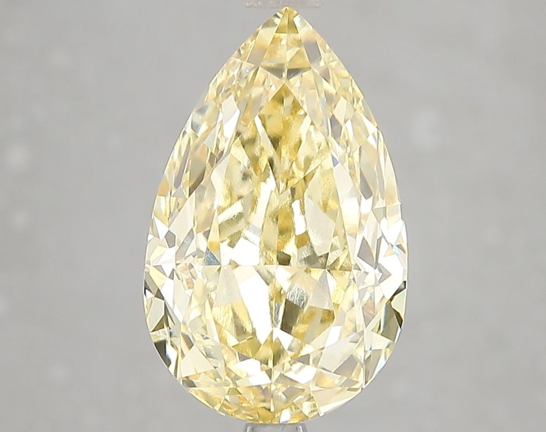 Loose Diamond - PEAR 5.11ct Fancy Vivid Yellow VVS2: Loose Diamond - PEAR 5.11ct Fancy Vivid Yellow VVS2 Source: This is a real non-mined Diamond that has been grown in a lab Shape: PEAR Carats: 5.11 Color: Fancy Vivid Yellow Certification: IGI Video: