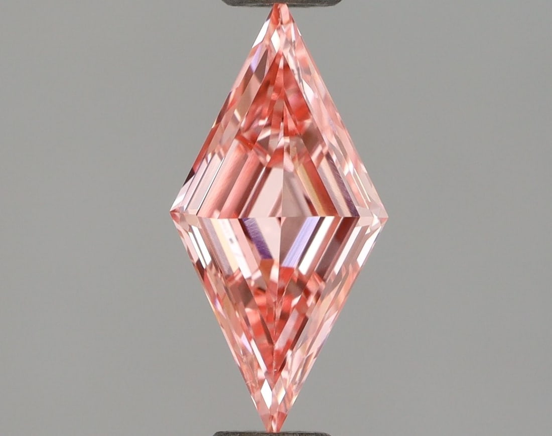 Loose Diamond - LOZENGE 0.57ct Fancy Vivid Pink VS1: Loose Diamond - LOZENGE 0.57ct Fancy Vivid Pink VS1 Source: This is a real non-mined Diamond that has been grown in a lab Shape: LOZENGE Carats: 0.57 Color: Fancy Vivid Pink Certification: IGI Video: