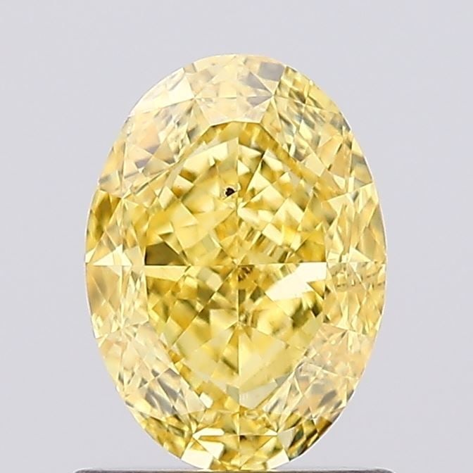Loose Diamond - OVAL 1.06ct Fancy Vivid Yellow VS2: Loose Diamond - OVAL 1.06ct Fancy Vivid Yellow VS2 Source: This is a real non-mined Diamond that has been grown in a lab Shape: OVAL Carats: 1.06 Color: Fancy Vivid Yellow Certification: IGI Video: