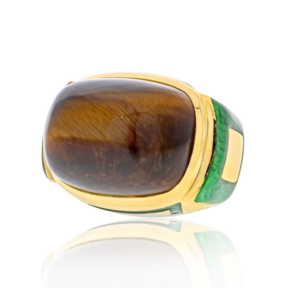 David Webb 18K Yellow Gold Green Enamel Tiger Eye Cocktail Ring: David Webb 18K Yellow Gold Green Enamel Tiger Eye Cocktail Ring This exquisite David Webb cocktail ring showcases a stunning blend of luxurious materials and bold design. Crafted in the 1970s at the r