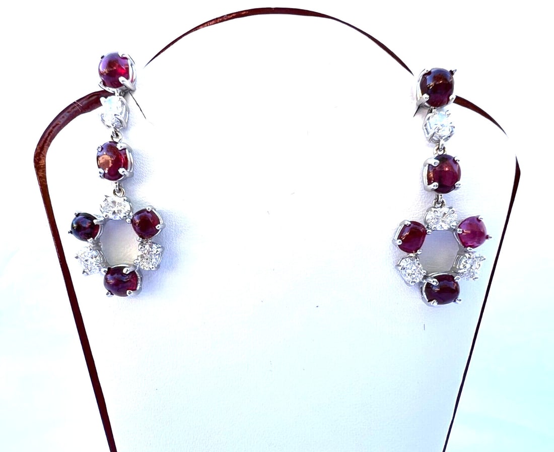 18K White Gold Chandelier Earrings GIA Certified Burma Rubies Diamonds: 18K White Gold Chandelier Earrings GIA Certified Burma Rubies Diamonds This exquisite pair of chandelier earrings showcases a stunning combination of 18K white gold, diamonds, and Burma rubies. Weighi