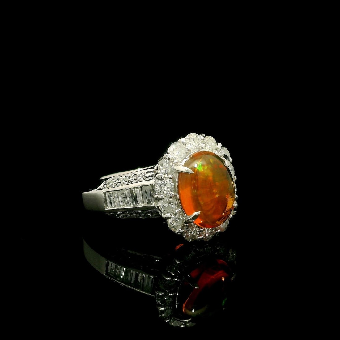 Platinum 2.48ctw Modern Ring with Oval Orange Jelly Opal and Diamonds: Platinum 2.48ctw Modern Ring with Oval Orange Jelly Opal and Diamonds This exquisite modern cocktail ring features a stunning 2.48ctw total weight, showcasing a vibrant oval jelly opal at its center. 