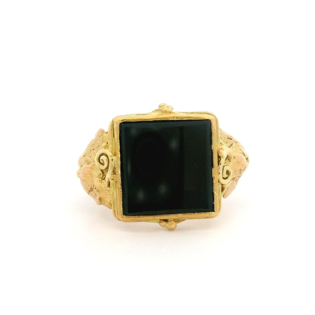 Vintage 21k Yellow Gold Black Onyx Grape Vine Ring: Vintage 21k Yellow Gold Black Onyx Grape Vine Ring This vintage cocktail ring showcases a stunning black onyx stone, expertly set in a heavy textured band crafted from yellow gold. The square-cut onyx