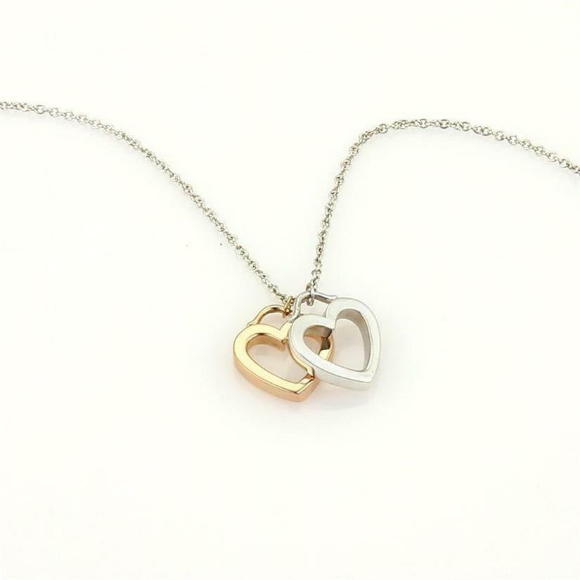 Tiffany & Co. Double Heart Pendant Sterling Silver 18k Rose Gold with Chain: Tiffany & Co. Double Heart Pendant Sterling Silver 18k Rose Gold with Chain This exquisite Tiffany & Co. Double Heart Pendant features a stunning combination of sterling silver and 18k rose gold. The 