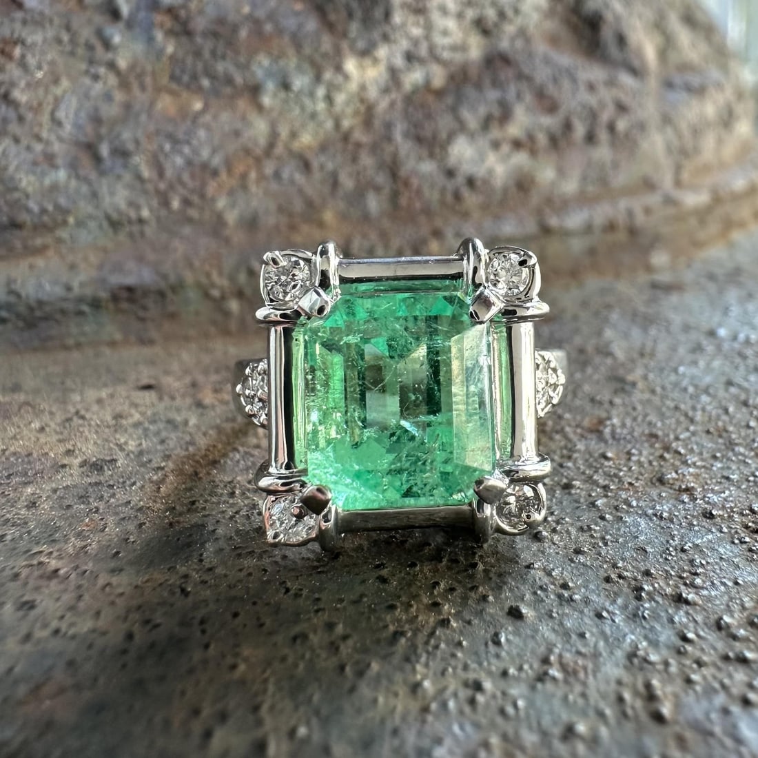 GIA Colombian emerald diamond platinum cocktail ring size 6: GIA Colombian emerald diamond platinum cocktail ring size 6 This vintage platinum cocktail ring features a natural Colombian emerald with GIA certification. The octagonal-cut emerald, weighing exactly