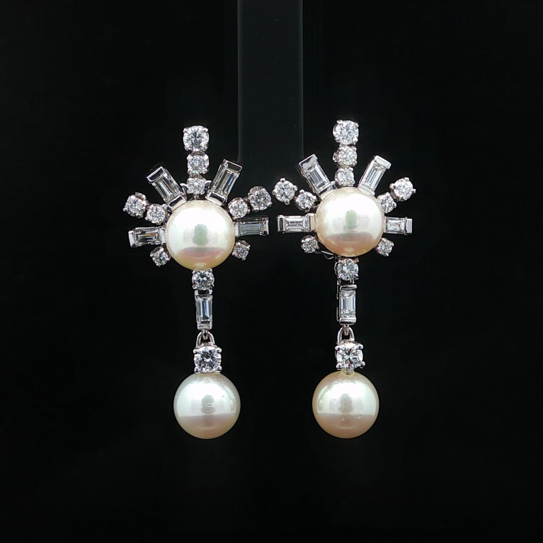 Mid Century White Gold Palladium Earrings with Diamonds and Cultured Pearls: Mid Century White Gold Palladium Earrings with Diamonds and Cultured Pearls These vintage mid-century dangle earrings feature a striking starburst design adorned with four genuine cultured pearls and 