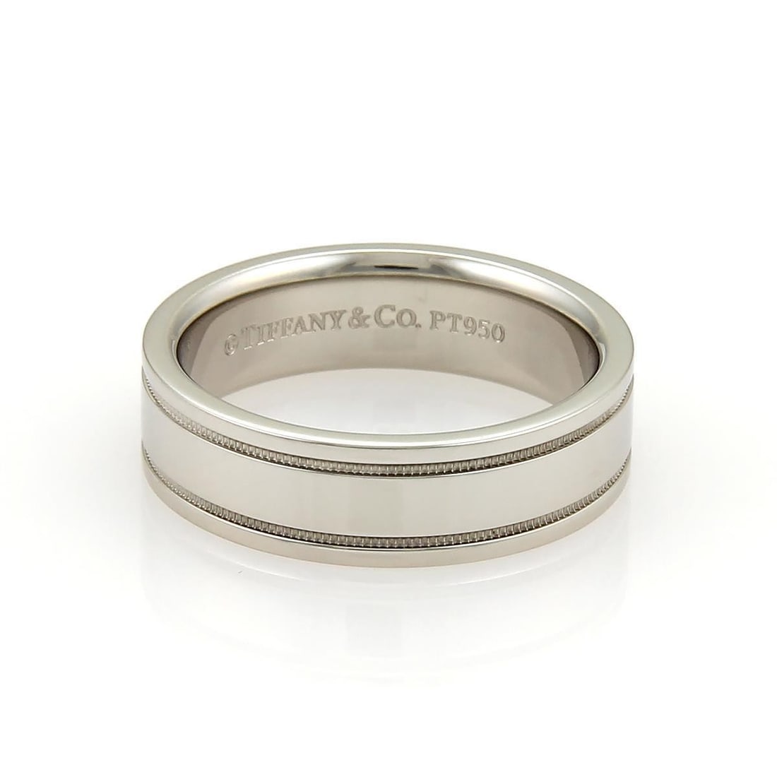 Platinum 6mm Double Milgrain Wedding Band by Tiffany Size 9: Platinum 6mm Double Milgrain Wedding Band by Tiffany Size 9 This Tiffany & Co. wedding band features a classic and elegant double milgrain design. Crafted from platinum with a high polished finish, th