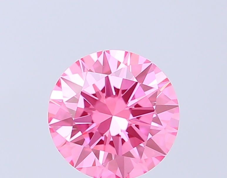 Loose Diamond - ROUND 1.0ct Fancy Vivid Pink VVS2: Loose Diamond - ROUND 1.0ct Fancy Vivid Pink VVS2 Source: This is a real non-mined Diamond that has been grown in a lab Shape: ROUND Carats: 1.0 Color: Fancy Vivid Pink Certification: IGI Video: