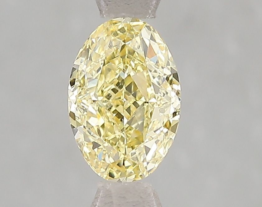 Loose Diamond - OVAL 1.02ct Fancy Vivid Yellow VS2: Loose Diamond - OVAL 1.02ct Fancy Vivid Yellow VS2 Source: This is a real non-mined Diamond that has been grown in a lab Shape: OVAL Carats: 1.02 Color: Fancy Vivid Yellow Certification: IGI Video:
