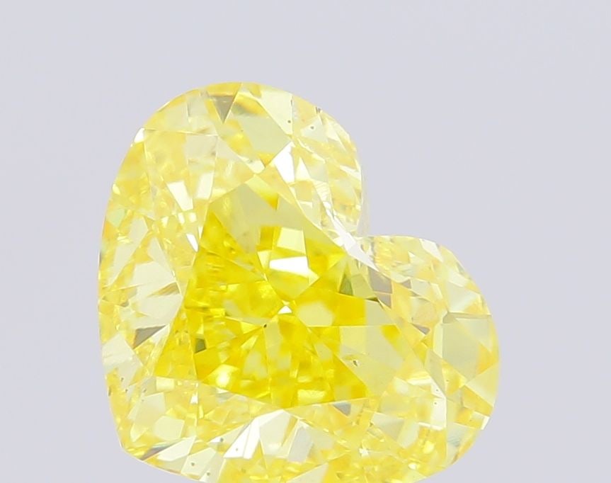 Loose Diamond - HEART 4.97ct Fancy Vivid Yellow VS2: Loose Diamond - HEART 4.97ct Fancy Vivid Yellow VS2 Source: This is a real non-mined Diamond that has been grown in a lab Shape: HEART Carats: 4.97 Color: Fancy Vivid Yellow Certification: IGI Video: