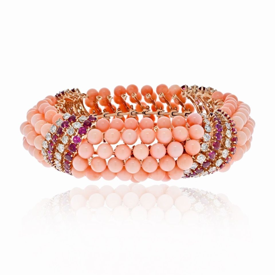 18K Yellow Gold Multi-Row Bracelet with Pink Coral Diamonds and Garnets: 18K Yellow Gold Multi-Row Bracelet with Pink Coral Diamonds and Garnets This exquisite bracelet features a luxurious design crafted from 18K yellow gold, showcasing a stunning array of pink coral bead