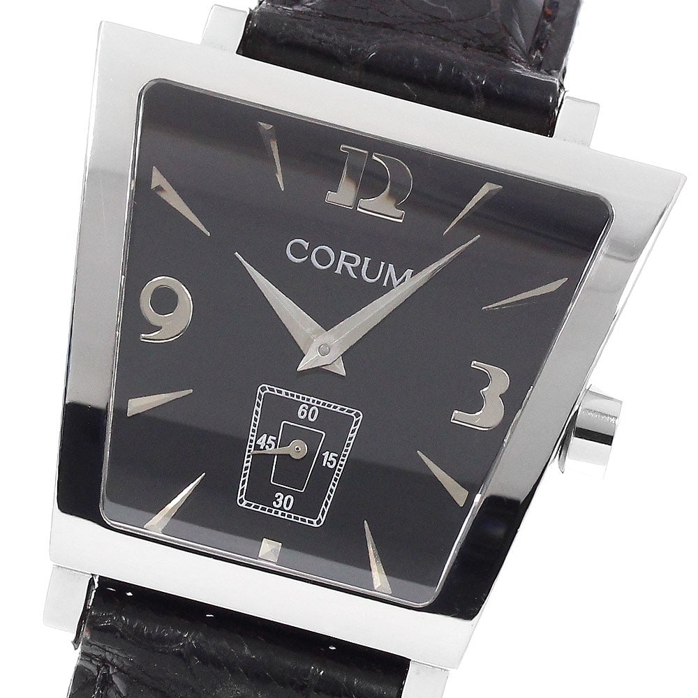 CORUM Trapeze Quartz Small Seconds Men's Wristwatch: CORUM Trapeze Quartz Small Seconds Men's Wristwatch This CORUM Trapeze Small Seconds men's wristwatch features a stainless steel case and a black dial, complemented by a leather strap. Powered by a qu