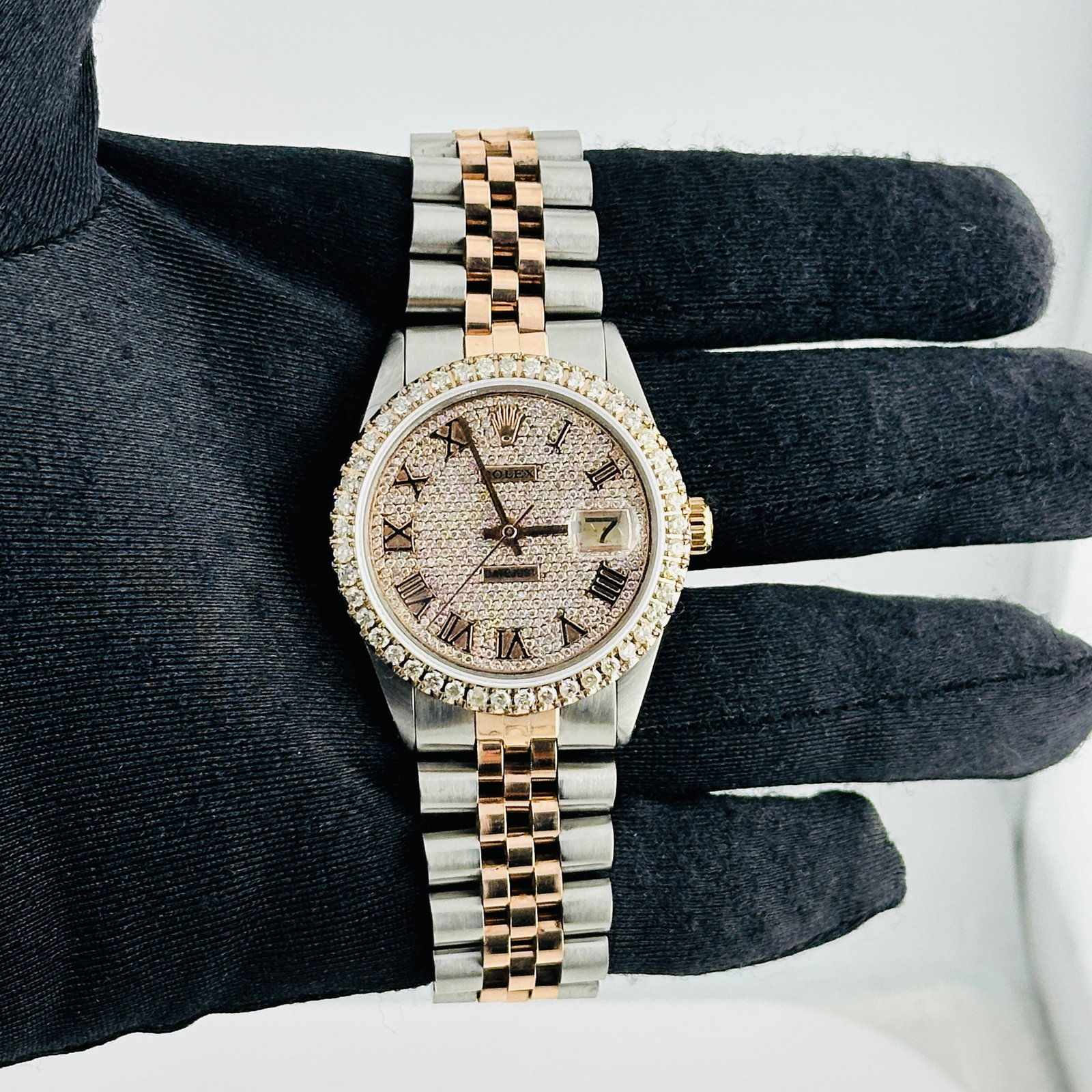 Rolex Datejust aftermarket iced Roman dial Jubilee bracelet Ref 1600: Rolex Datejust aftermarket iced Roman dial Jubilee bracelet Ref 1600 This is a men's Rolex Datejust watch, reference 1600, featuring an aftermarket iced out Roman numeral dial. The bezel is prong-set 