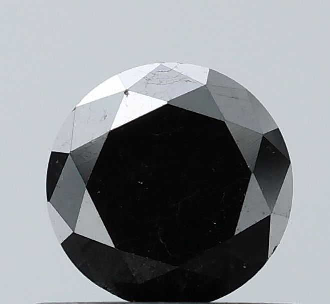 Loose Diamond - ROUND 0.68ct Fancy Black VVS2: Loose Diamond - ROUND 0.68ct Fancy Black VVS2 Source: Natural Shape: ROUND Carats: 0.68 Color: Fancy Black Certification: NONE Video: