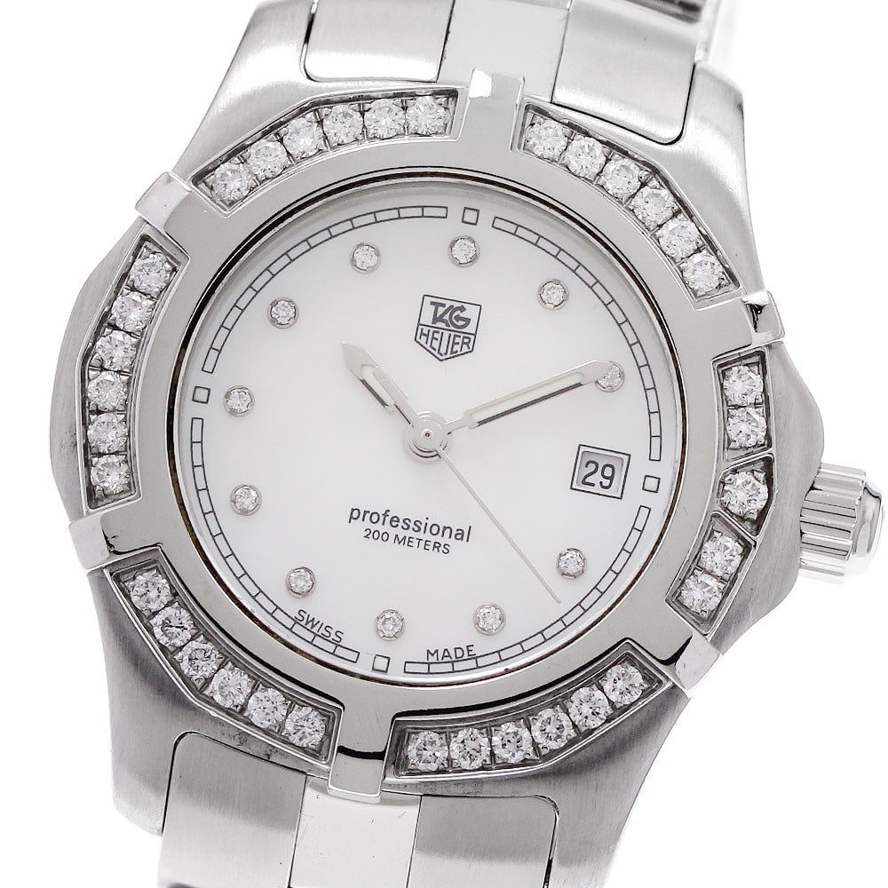 TAG Heuer Women's Quartz Wristwatch 11 Diamond Bezel Date WN131J-0: TAG Heuer Women's Quartz Wristwatch 11 Diamond Bezel Date WN131J-0 This TAG Heuer WN131J-0 2000 Exclusive wristwatch features a quartz movement and an elegant design tailored for women. The watch is a