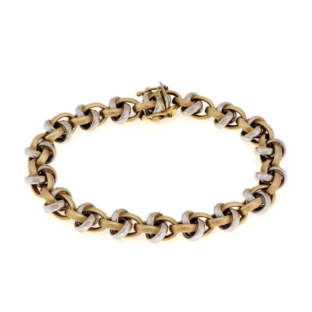 Elegant 14k Two Tone Gold Double Interlace Bracelet 7.5" L: Elegant 14k Two Tone Gold Double Interlace Bracelet 7.5" L This exquisite bracelet showcases a stunning design crafted from 14k yellow and white gold. The polished gold strips are elegantly fashioned 