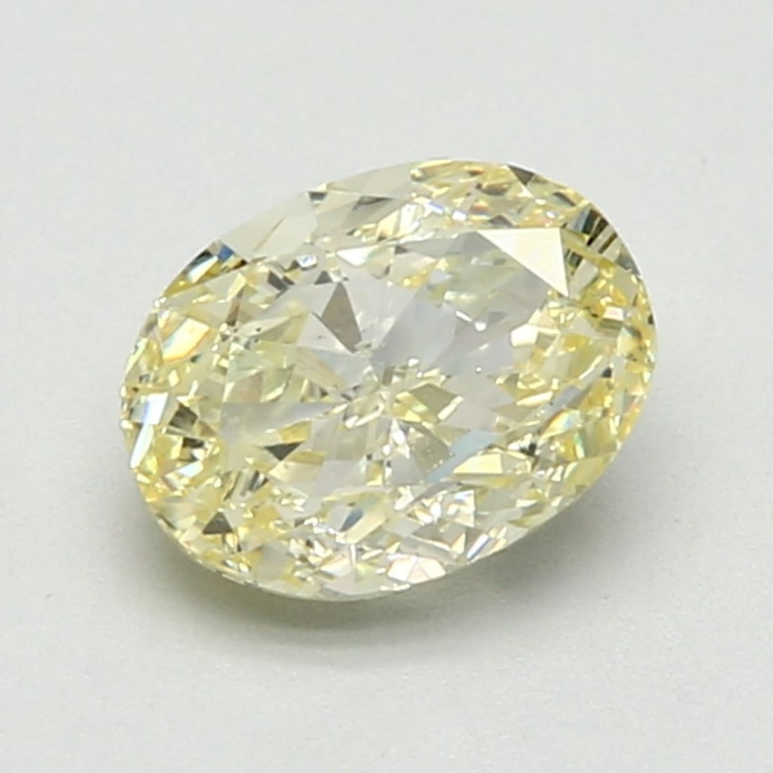 Loose Diamond - OVAL 1.51ct Fancy Light Yellow: Loose Diamond - OVAL 1.51ct Fancy Light Yellow Source: Natural Shape: OVAL Carats: 1.51 Color: Fancy Light Yellow Certification: GIA Video:
