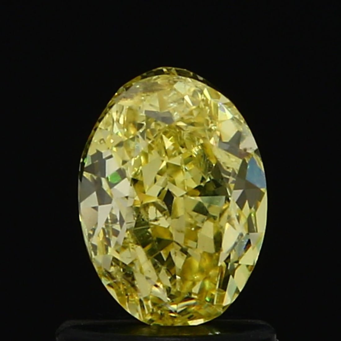 Loose Diamond - OVAL 0.98ct Fancy Intense Yellow SI2: Loose Diamond - OVAL 0.98ct Fancy Intense Yellow SI2 Source: Natural Shape: OVAL Carats: 0.98 Color: Fancy Intense Yellow Certification: GIA Video: