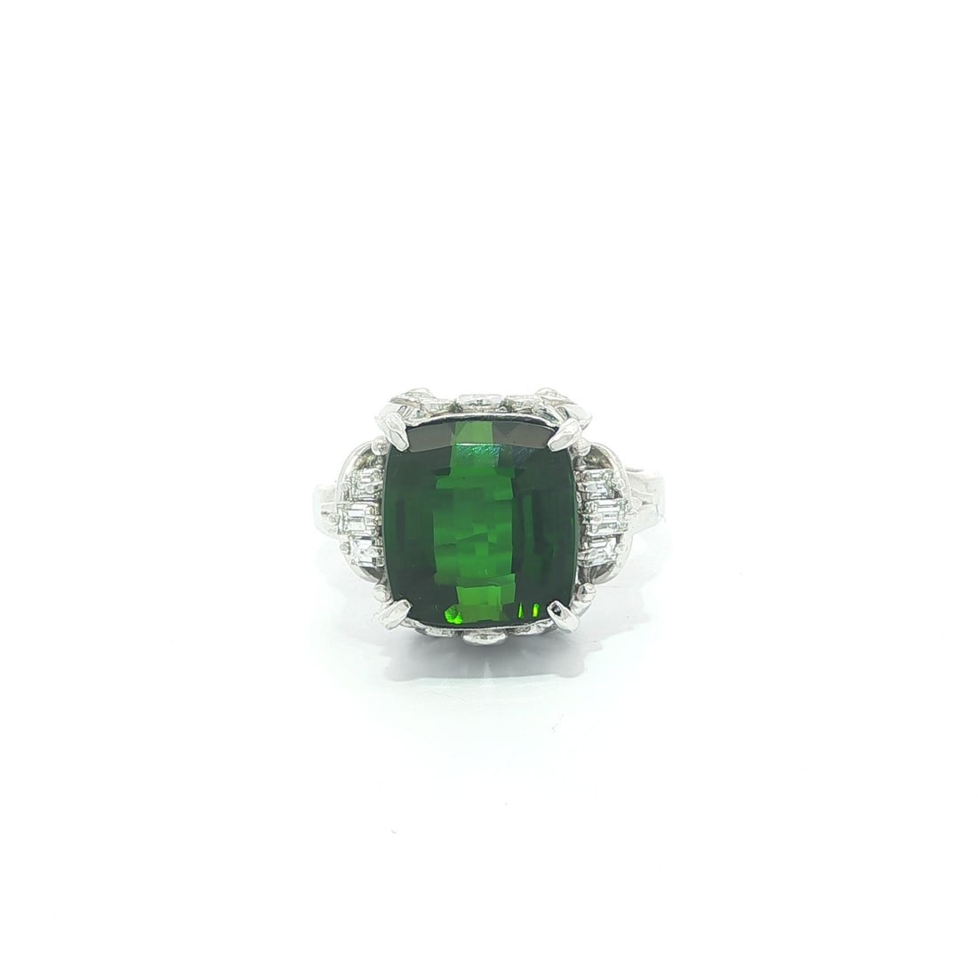 Platinum Ring with Green Tourmaline and Baguette Diamond Details Size 5.5: Platinum Ring with Green Tourmaline and Baguette Diamond Details Size 5.5 This platinum cocktail ring features a vivid deep green, natural square-cut tourmaline weighing 5.52ct, accented by five strai