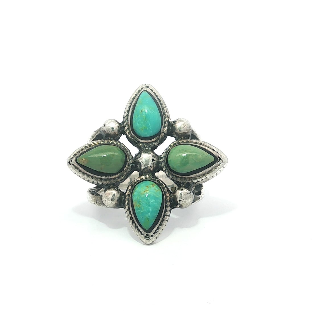 Sterling Silver Turquoise Ring with Two Pear Cabochons Size 8.5: Sterling Silver Turquoise Ring with Two Pear Cabochons Size 8.5 This large vintage ring is crafted from .925 sterling silver and features four natural turquoise stones in pear cabochon cuts. Two stone