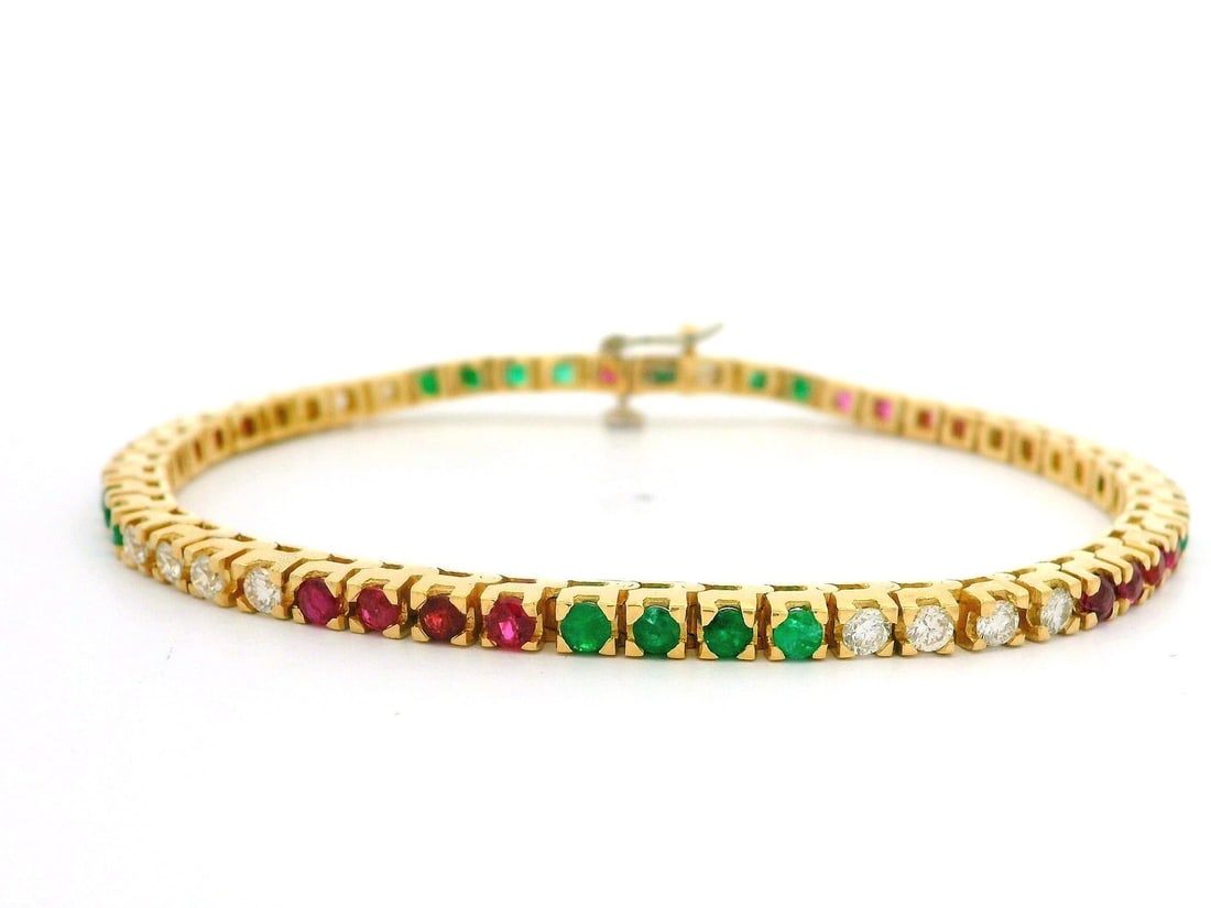 18k Yellow Gold 3.36ctw Multi Color Emerald Ruby Diamond Tennis Bracelet: 18k Yellow Gold 3.36ctw Multi Color Emerald Ruby Diamond Tennis Bracelet This exquisite tennis bracelet showcases a stunning array of gemstones set in solid 18k yellow gold. It features a total carat 