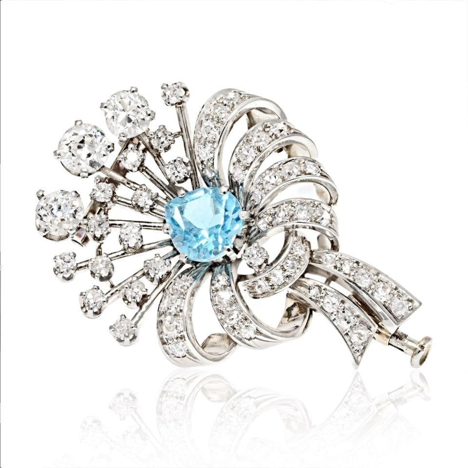 Art Deco Platinum Mini Flower Brooch with 3 Carats Diamonds and Aquamarine: Art Deco Platinum Mini Flower Brooch with 3 Carats Diamonds and Aquamarine This exquisite brooch from the Art Deco era showcases a delicate mini flower design, crafted in luxurious platinum. Weighing 