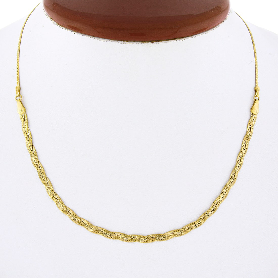 Italian 14k Yellow Gold Braided Flat Link Necklace 16 Inch: Italian 14k Yellow Gold Braided Flat Link Necklace 16 Inch This Italian-crafted necklace features a unique, fancy braided flat link design in solid 14k yellow gold. Measuring 16 inches in length, the 