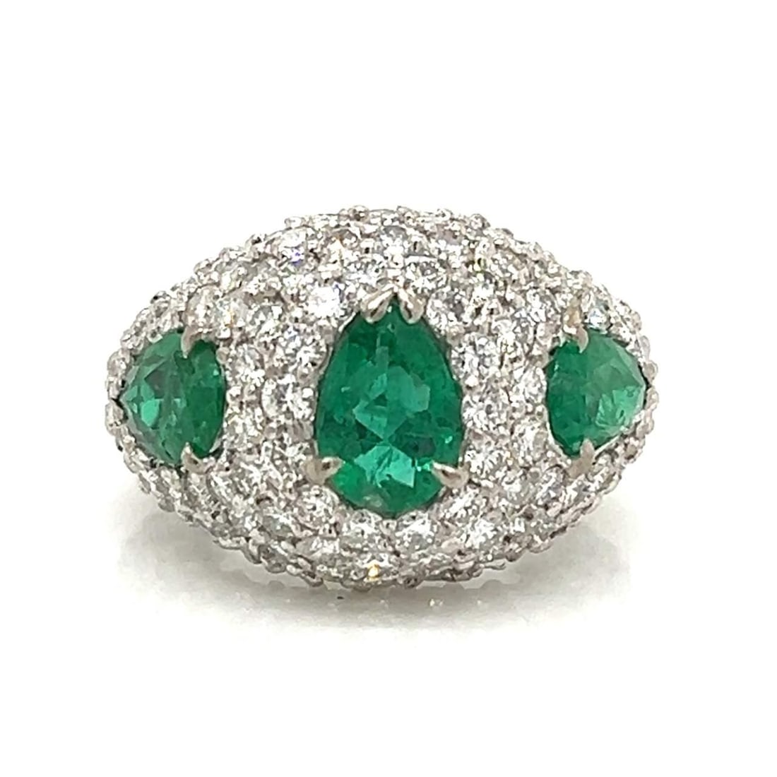 18K White Gold Emerald Diamond Cocktail Ring 3.50 Ct Emerald 6.00 Ct Diamonds: 18K White Gold Emerald Diamond Cocktail Ring 3.50 Ct Emerald 6.00 Ct Diamonds This exquisite cocktail ring is crafted from 18K white gold and features a stunning arrangement of three vibrant emeralds,
