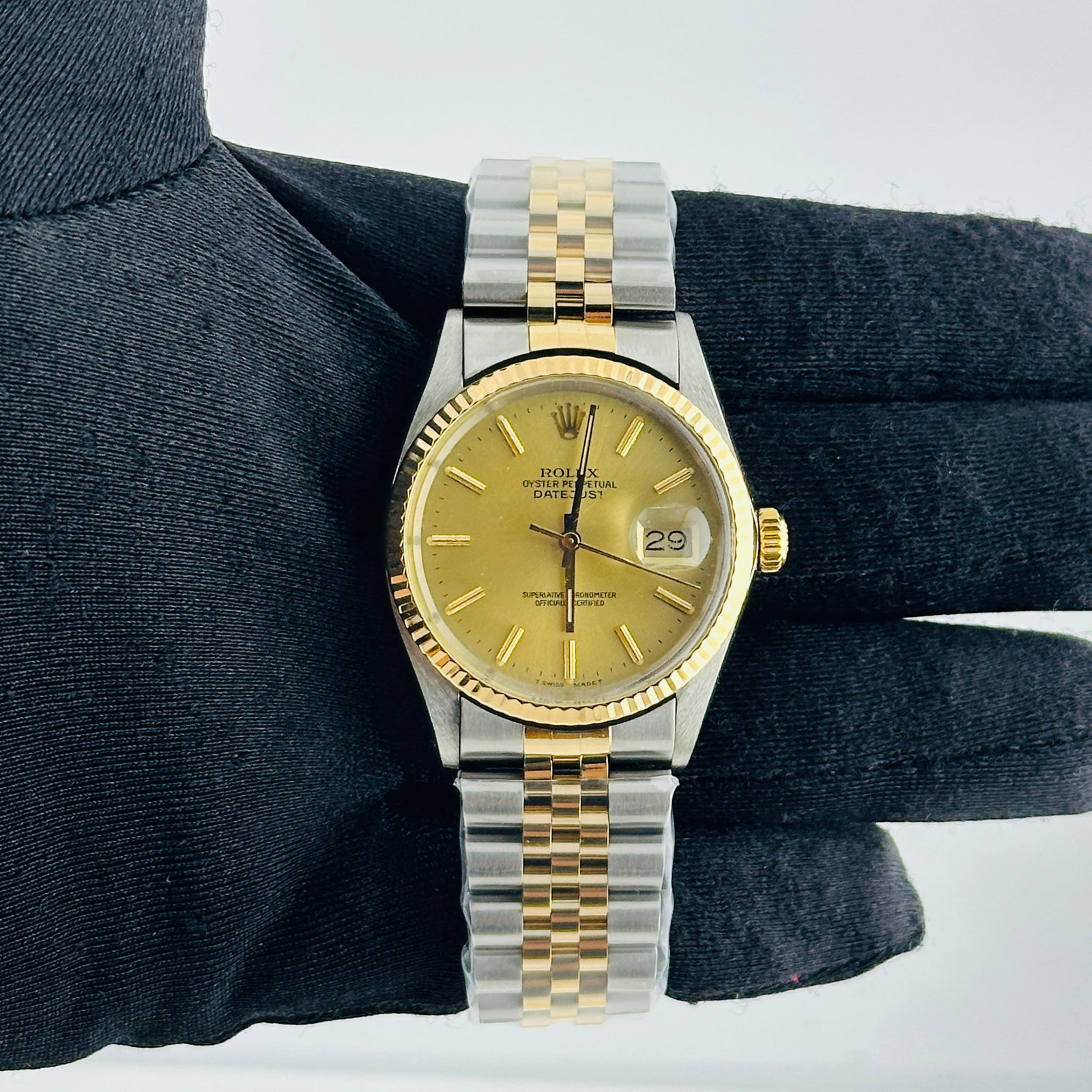 Rolex Datejust 16013 Champagne Stick Dial Aftermarket Jubilee Bracelet: Rolex Datejust 16013 Champagne Stick Dial Aftermarket Jubilee Bracelet This Rolex Datejust features a champagne stick dial and a fluted bezel, complemented by an aftermarket Jubilee bracelet. The watc