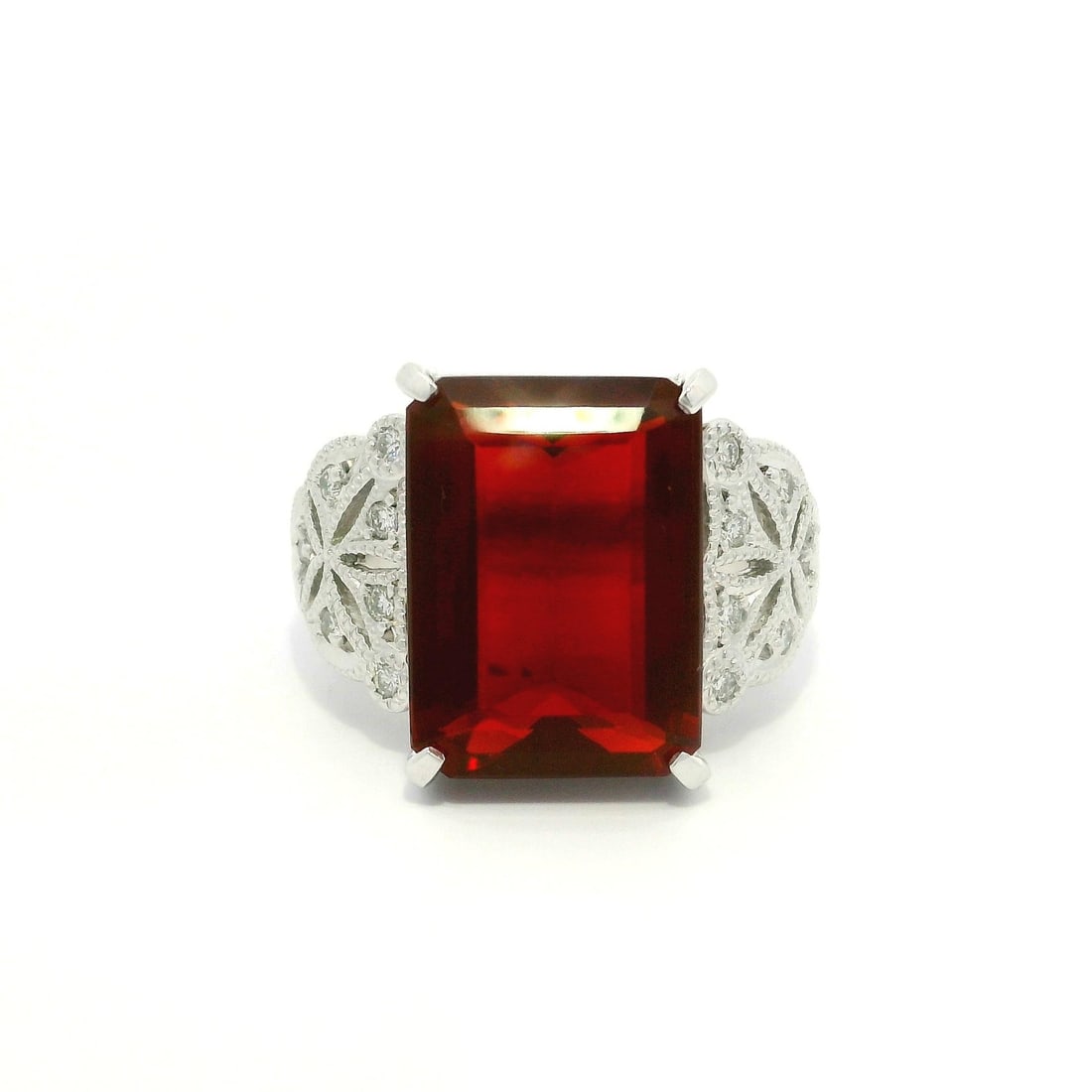 Platinum Cocktail Ring 5.81ct Emerald Cut Fire Opal & Diamonds: Platinum Cocktail Ring 5.81ct Emerald Cut Fire Opal & Diamonds This stunning cocktail ring showcases a breathtaking natural genuine fire opal in an emerald cut, measuring 14.9x10.9 mm and weighing 5.6
