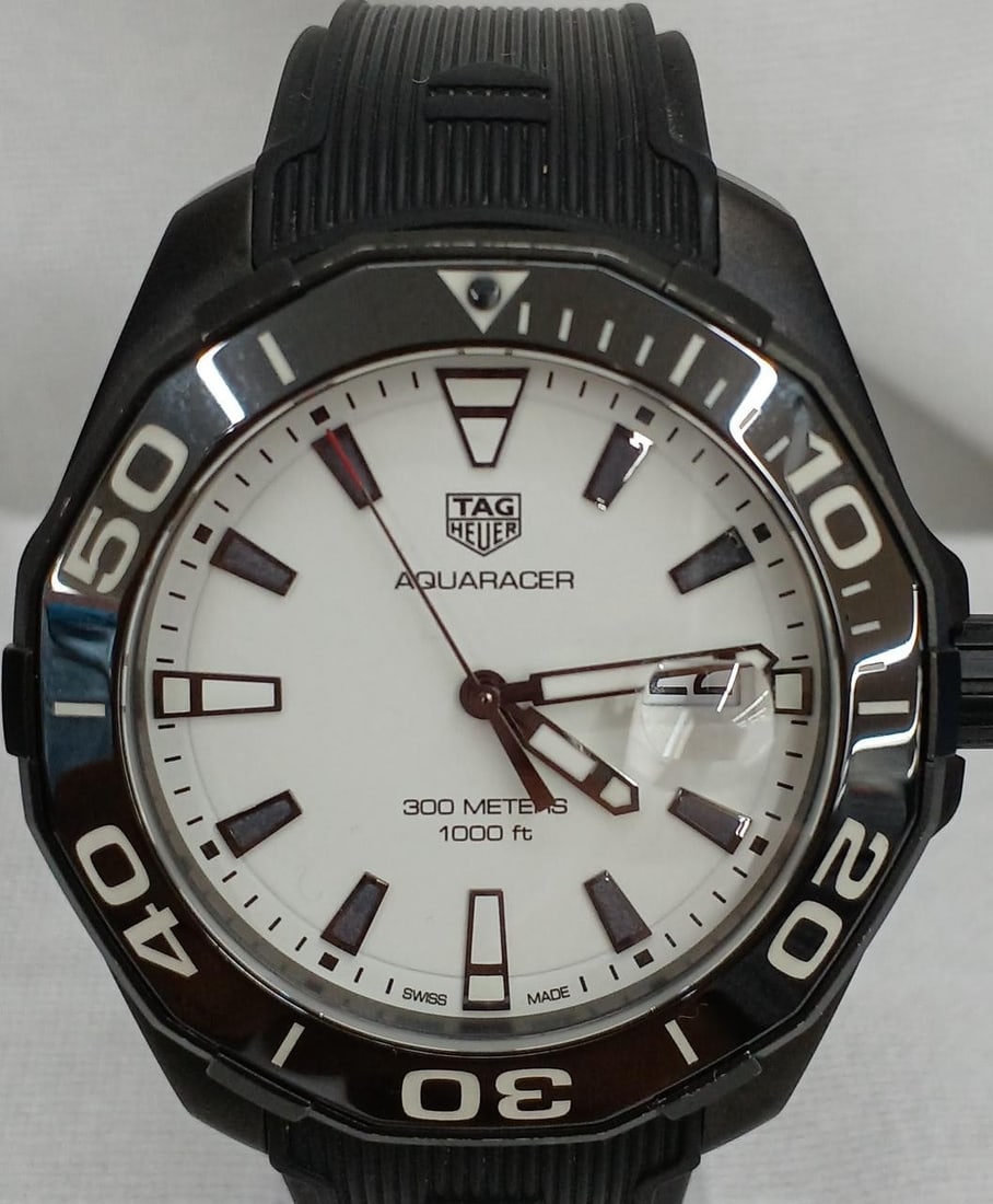 Mens Quartz Wristwatch TAG Heuer Aquaracer Night Diver Titanium WAY108A.FT6141: Mens Quartz Wristwatch TAG Heuer Aquaracer Night Diver Titanium WAY108A.FT6141 TAG Heuer Aquaracer Night Diver quartz titanium men's wristwatch. This pre-owned watch is described as Swiss-made and is 