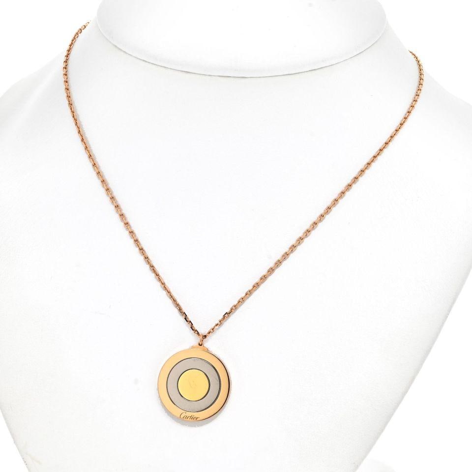 Cartier 18K Tri Color Bullseye Pendant with 16 Inch Chain: Cartier 18K Tri Color Bullseye Pendant with 16 Inch Chain Discover this exquisite Cartier pendant, a true embodiment of luxury and artistry. Crafted in 18K tri-color gold, this pendant features a stun
