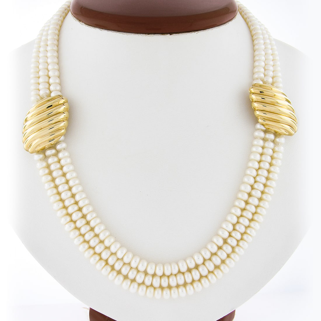 21.5 Inch 3 Row Cultured Pearl Necklace with 14k Gold Stations: 21.5 Inch 3 Row Cultured Pearl Necklace with 14k Gold Stations Elevate your style with this stunning 21.5-inch 3-row pearl strand necklace. The necklace features numerous cultured pearls, each semi-ro