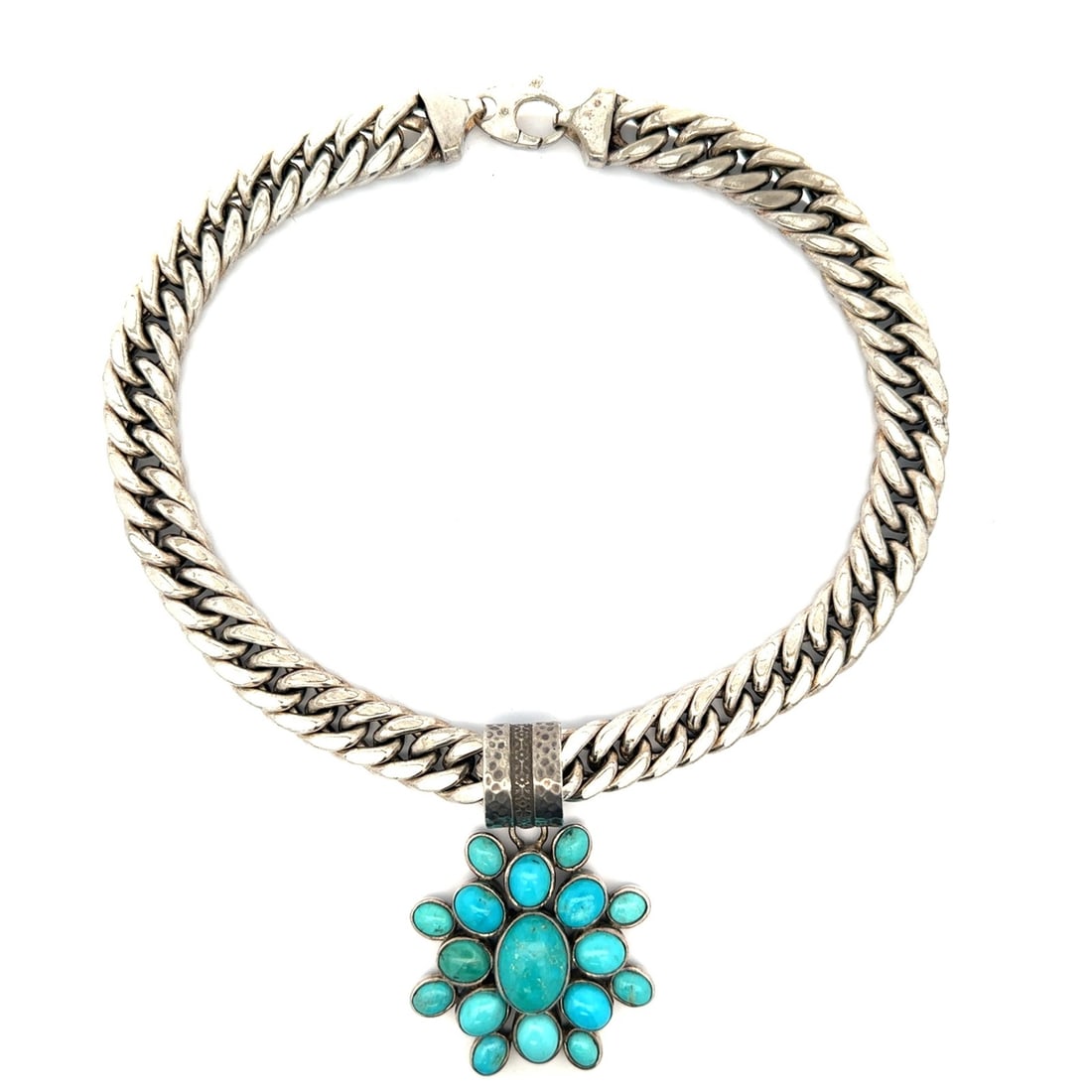 Sterling Silver Turquoise Cabochon Cluster Flower Pendant on Curb Link Necklace: Sterling Silver Turquoise Cabochon Cluster Flower Pendant on Curb Link Necklace This vintage necklace features a large cluster flower pendant crafted from solid sterling silver and adorned with natura