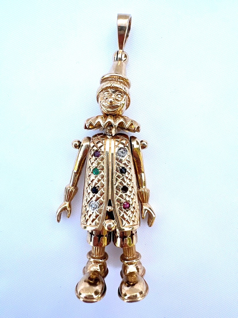 English 9K Gold Movable Pendant with Diamonds Rubies Emeralds Sapphires: English 9K Gold Movable Pendant with Diamonds Rubies Emeralds Sapphires This exquisite pendant showcases a stunning combination of diamonds, rubies, emeralds, and sapphires set in 9K yellow gold. Weig
