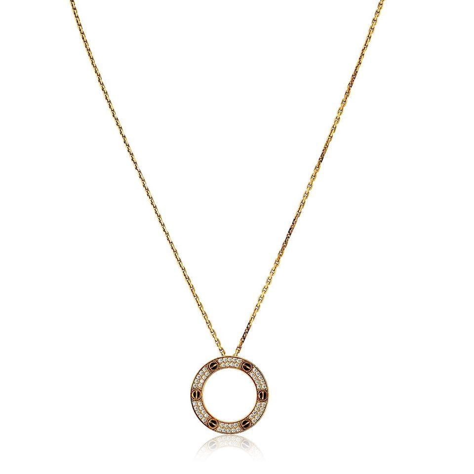 Love Pendant in 18K Yellow Gold by Cartier: Love Pendant in 18K Yellow Gold by Cartier This is a pre-owned Cartier Love pendant crafted from 18K yellow gold. The pendant features the iconic Love collection design and weighs 17.2 grams. Specific